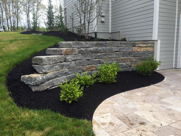 stone retaining wall built by Freedom Stone + Pondscapes