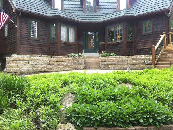 stone retaining wall with stairs built by Freedom Stone + Pondscapes