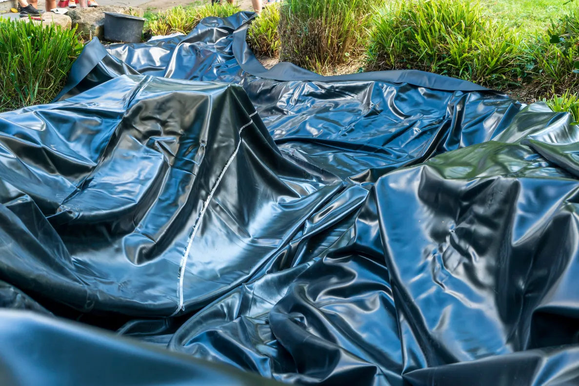 Pond liner laid in a stream
