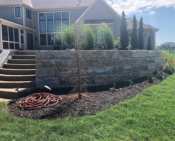 Yard retaining wall with steps