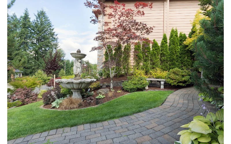 Frontyard with tall concrete fountain
