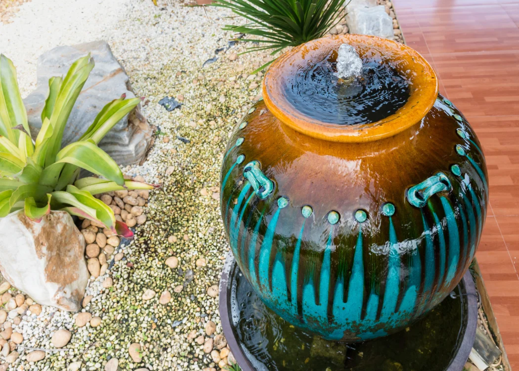 Smaller bubbling urn garden fountain