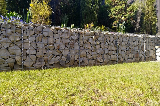 Gabion retaining wall in backyard