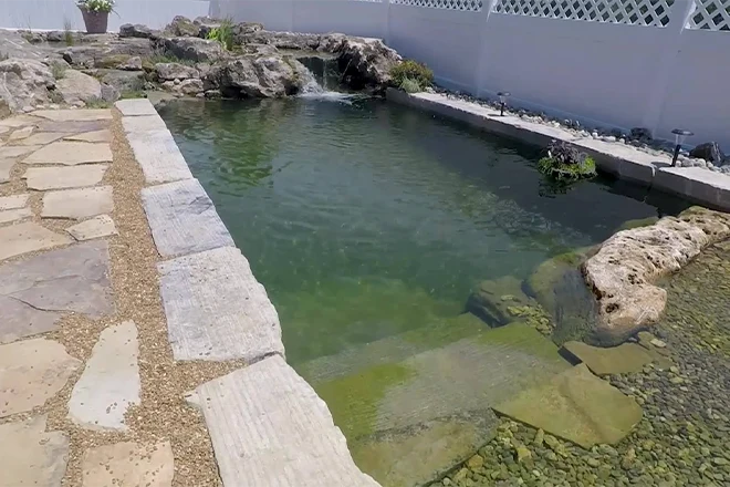 Retaining wall used to create a swim pond