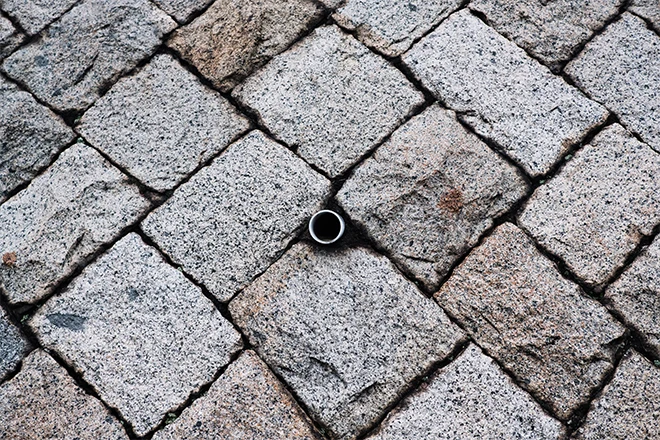 Drain hole pipe in retaining wall