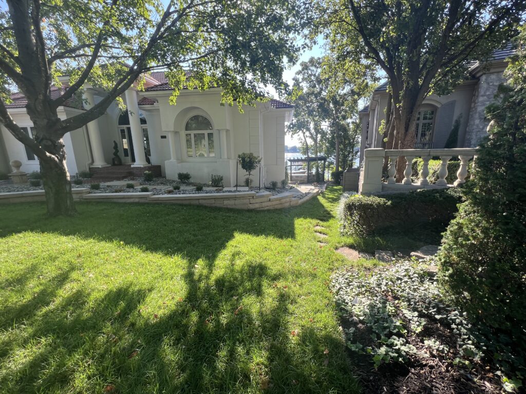 Elegant house with lush garden and trees